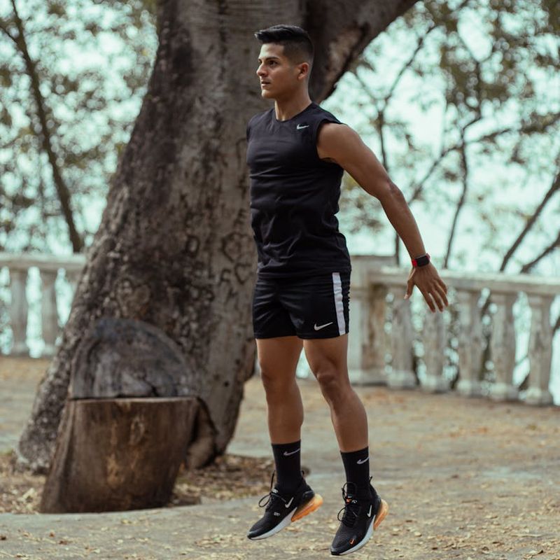 Person in mid-motion during a fluid exercise routine.